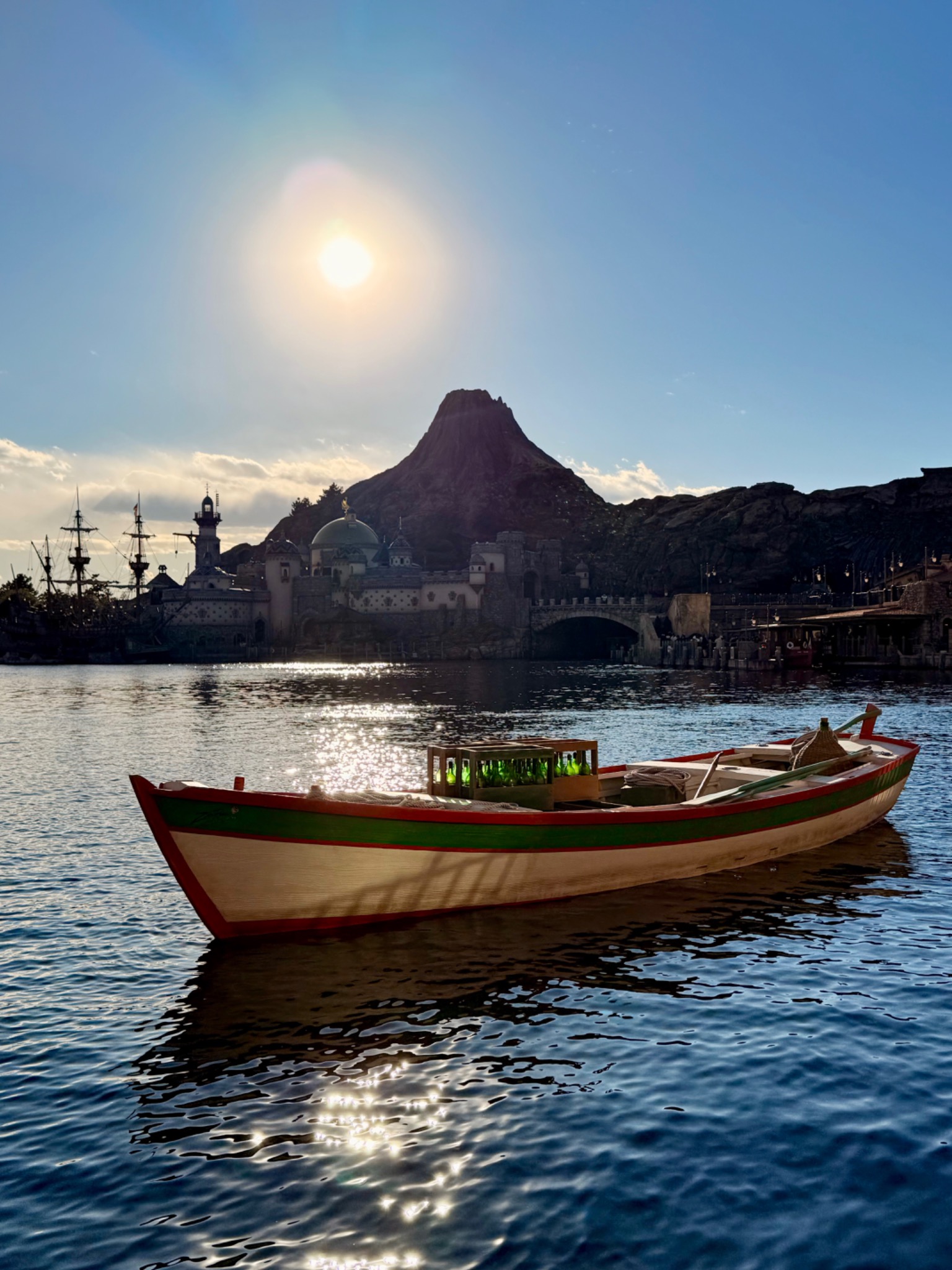 Boat on the water with a mountain in the distance